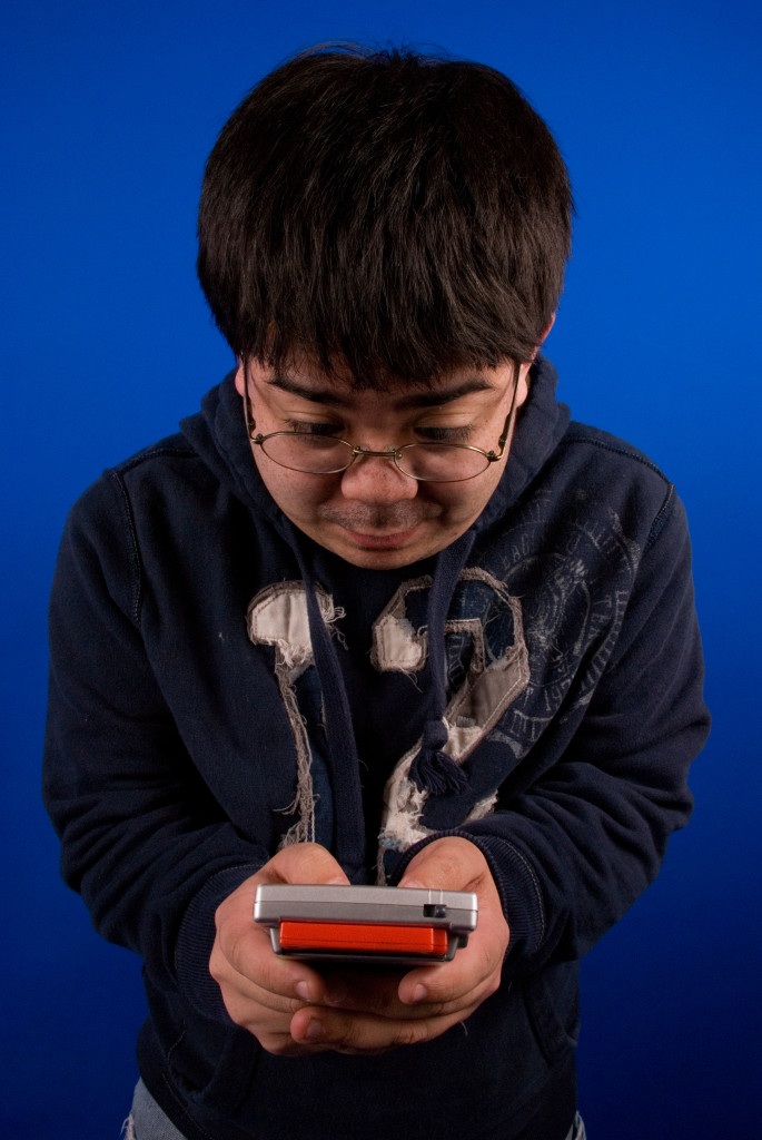 Gamer playing Game Boy